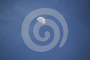 Half moon in the blue sky background