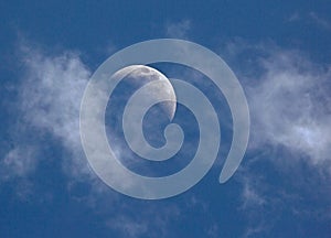 Half Moon and Clouds in a Deep Blue Sky