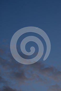 half moon floating on blue sky in twilight background