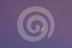 half moon floating on blue sky in twilight background
