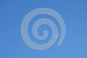 half moon floating on blue sky in twilight background