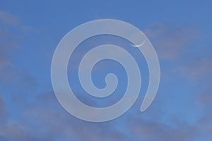 half moon floating on blue sky in twilight background