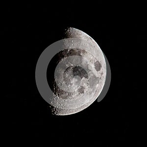 Half moon in the night sky in december