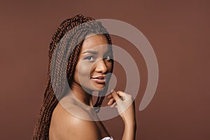 Half-naked black woman smiling and looking at camera