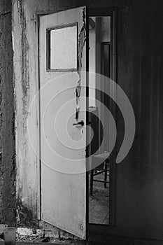Creaking door in old abandoned house interior photo
