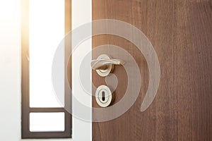 Half opened door to a ampty room. Door handle, door lock. Welcome, to new home concept