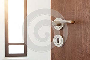 Half opened door to a ampty room. Door handle, door lock. Welcome, to new home concept