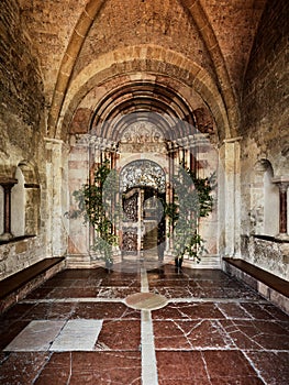 Half-opened magnificent old side entrance door to a church in Salzburg