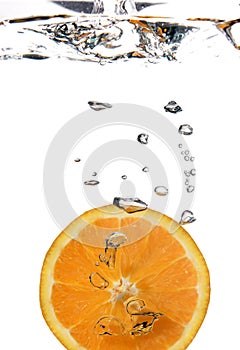 Half orange in water