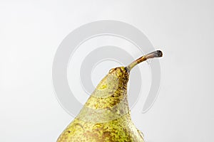 Half of pear with water drop on the peduncle