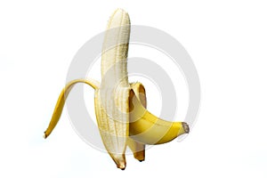 Half peeled ripe banana on white background. isolated