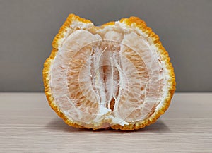 Half peeled tangerine show its pulps