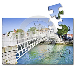 Half penny bridge the most famous bridge in Dublin - Ireland - Concept image in jigsaw puzzle shape with copy space