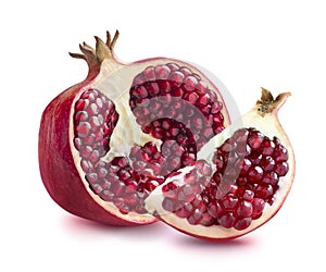 Half of pomegranate and quarter slice on white backgrou