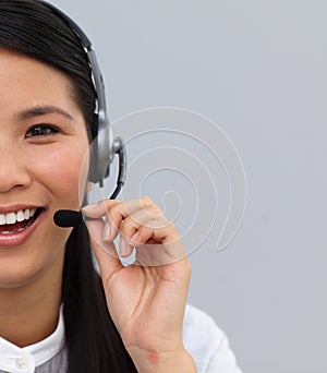 Half portrait of an asian secretary with earpiece