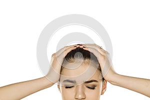 Half portrait of young mad woman with headache