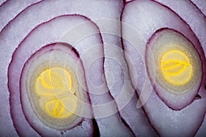 Half of purple onion close up.Chopped onion, red hot pepper and spice isolated on top view, close-up, selective focus