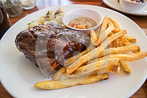 Half rack of barbecue pork ribs with french fries