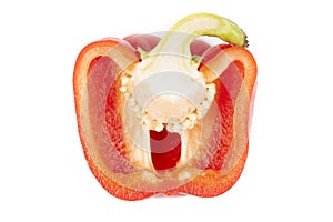 Half red pepper with seeds inside, top view
