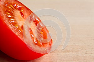 Half of a red ripe tomato