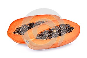 Half of ripe papaya fruit with seeds isolated on white