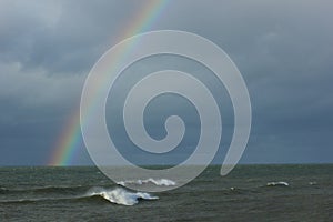 Half Sea rainbow at cloudy day