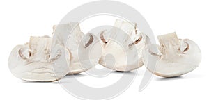Half sliced champignons on white isolated background. Close-up.