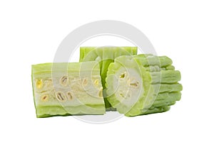 Half sliced fresh green bitter cucumber or chinese bitter melon isolated on white background with clipping path