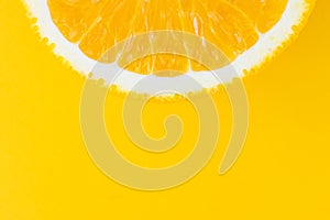 Half sliced â€‹â€‹orange on a bright orange background.