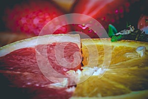 Half slices of ruby red grapefruit and orange