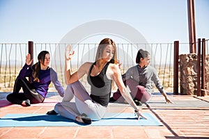 Half spinal twist pose in yoga class