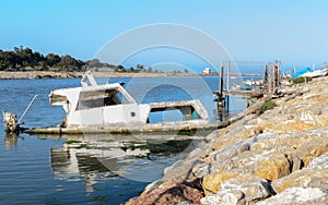 Half-sunken boat in the port photo
