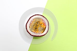 Half of tasty passion fruit maracuya on color background, top view