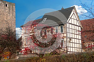 Half timbered house near old castle wall