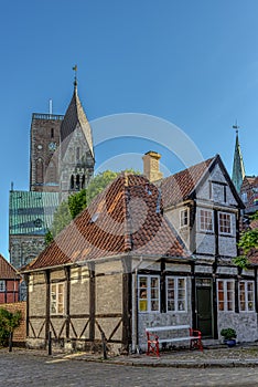 A half-timbered house and the Ribe cathedral in the background