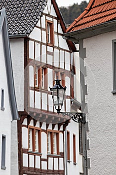 Half-timbered house and street lamp in Bad Muenstereifel