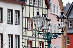 Half-timbered house and street lamps in Bad Muenstereifel