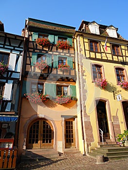 Half-timbered houses, colours, flowers, in a typical alsatian town, Riquewihr