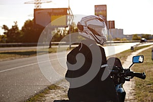 Half-turned biker on his motorcycle