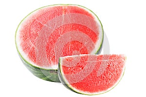 Half watermelon with a cut out slice isolated on white