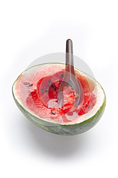 Half watermelon with spoon