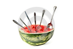 Half watermelon with spoons isolated on white background.