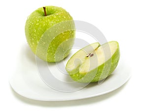 Half and whole green apple
