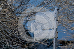 Halfway covered street signs with snow from Germany