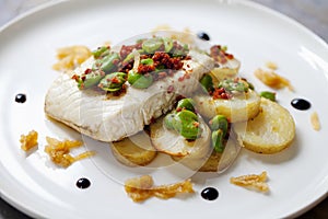 Halibut with baby potatoes, broad beans and chorizo