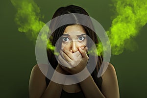 Halitosis concept of woman with bad breath photo