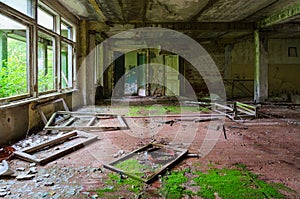 Hall of abandoned school in resettled village of Pogonnoe in exclusion zone of Chernobyl nuclear power plant, Belarus