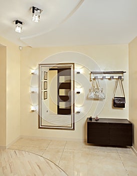 Hall in beige tones with hallstand and mirror
