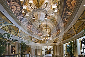 Hall with ceiling drawings and two chandeliers