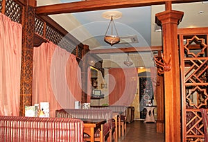 Hall in the Eastern restaurant. Sofas and curtains.